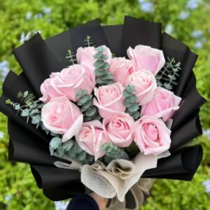 Pink rose bouquet with eucalyptus and black wrapping in Lebanon