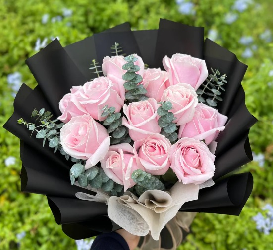 Pink rose bouquet with eucalyptus and black wrapping in Lebanon